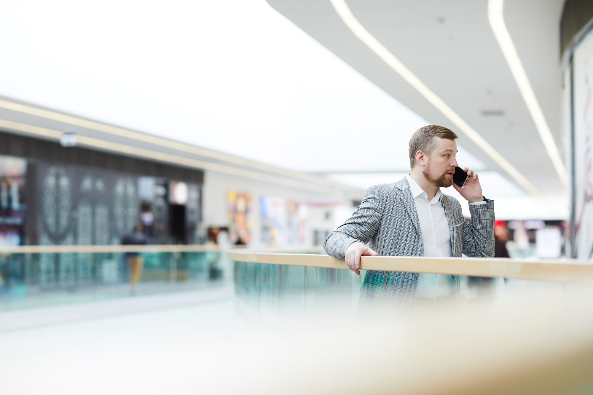 Enterprising man solving work issues on phone